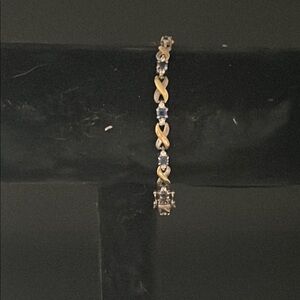 Elegant Silver and Gold Bracelet with Sapphire and Diamond Accents